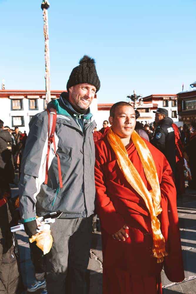 a monk with my husband in Tibet